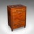 This is an antique cocktail cabinet. An English, mahogany and boxwood counterweighted dry bar, dating to the late...