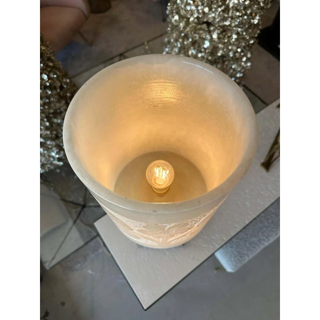 French Polynesian designed carvings on to the alabaster shade and body, this heavy and important table lamp has been...