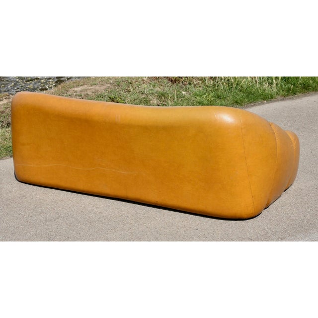 3-seater "Space Age" sofa, orange faux leather, 1970s Comfortable Note: streaks in the faux leather (not through) on the...