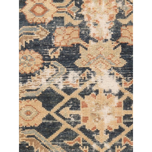 A lovely antique Malayer handwoven rug with blues and an abrash in soft gray. Abrash is a natural change in color that...