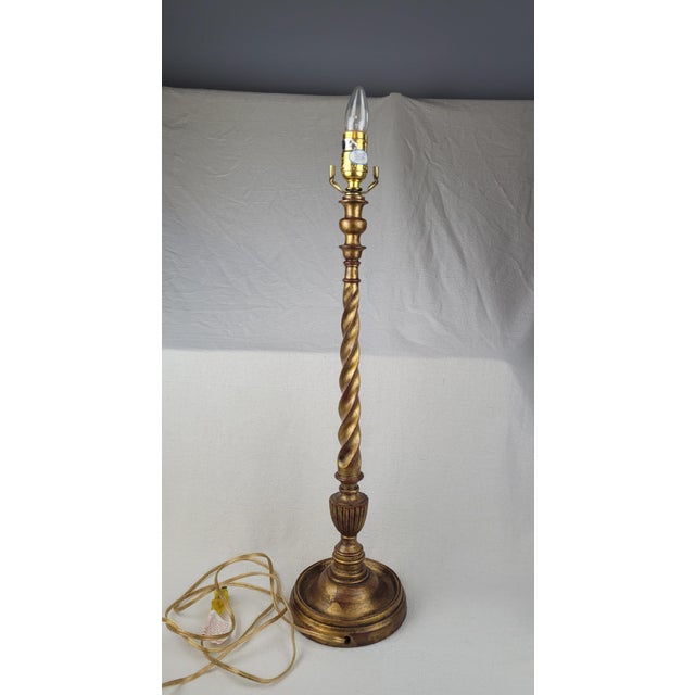 This vintage buffet lamp features a striking barley twist stem with a distressed gold gilt finish. The elegant candlestick...