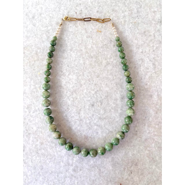 Stunning collection of antique fine green jade beaded necklace. Re strung with new gold tone clasp. 18”
