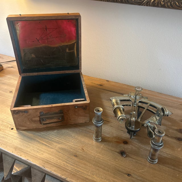 Sextant, antique about 1880, made by Henry Barrow, walnut case, measures about 5” high, 10” wide, 9” deep.