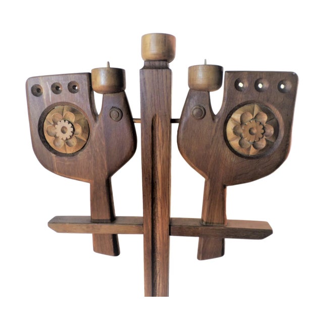 This very large wooden candelabra from the 1960s features three candle holders and is decorated with stylized birds and...