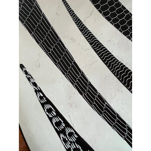 One-of-a-kind handcrafted ceramic plate. Featuring an elaborate hand-painted pattern in black and white. No maker's mark....