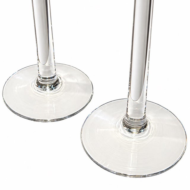 Stunning pair of tall, clear glass cylinder candleholders by Orrefors, Sweden. Simple yet striking, these elegant...