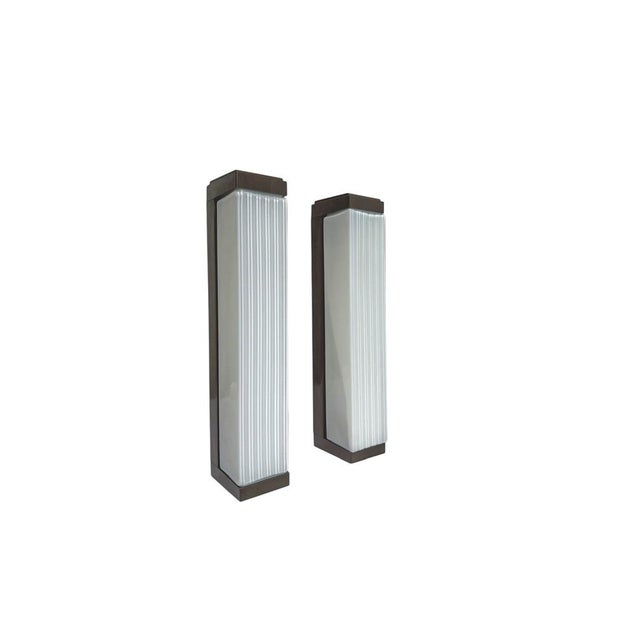 A set of wall lamps from the 1960s, produced by Herda Lamp-atelier Amsterdam. They bear Herda’s early first-generation...