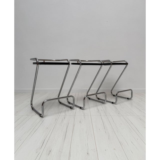 Set of 3 Vintage Barstools in a timeless, minimalist design. The stools feature a sleek chrome-plated frame combined with...