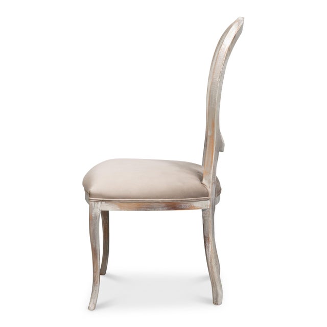 Painted cane and the surrounding frame share a gray wash, keeping the oval back in one quiet tone. A taupe fabric seat...