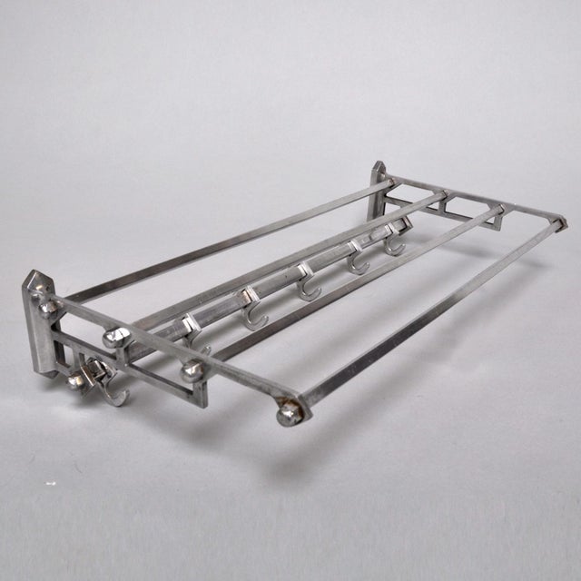 Wall coat rack in art deco style from the 1950s, made of iron and aluminium and equipped with 6 sliding hooks on a square...