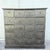 Unique vintage wooden apothecary chest featuring 20 individual drawers with hand-carved geometric and tribal-inspired...