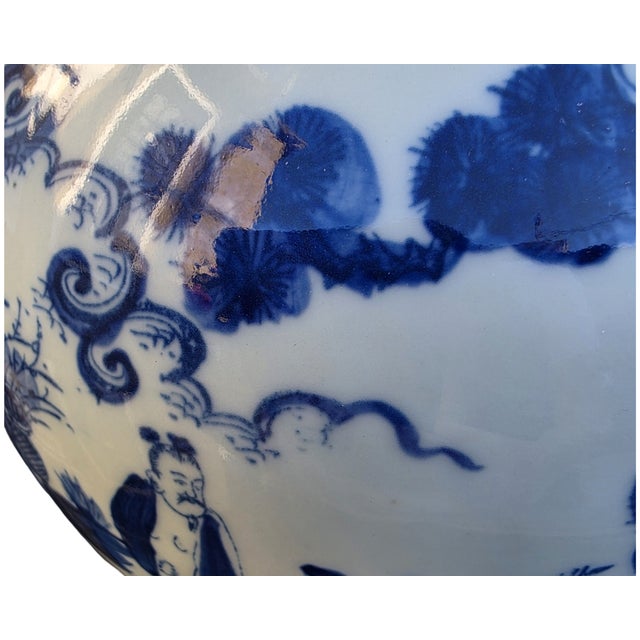 Elegant Chinese blue and white double gourd porcelain vase featuring finely painted scholar and landscape scenes with...