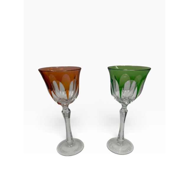 A striking pair of mid-century modern Bohemian cut-to-clear crystal wine stemware in a vibrant harlequin palette. This...