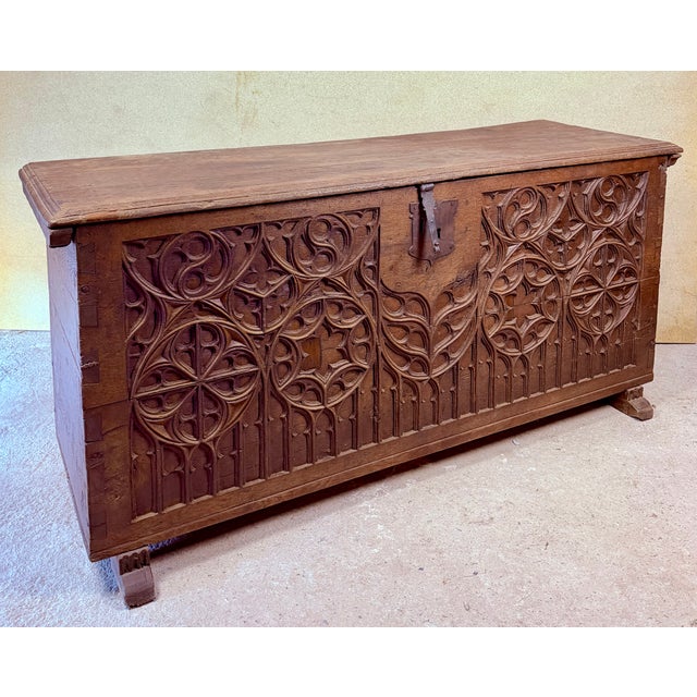Impressive Spanish wooden chest dating from the late 19th century, featuring richly carved geometric and architectural...
