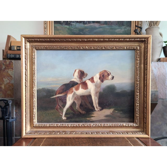 Stunning 19th century oil painting depicting two English pointers on the hunt. The medium is oil on mahogany panel....