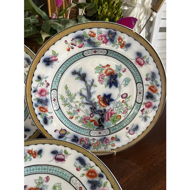 A lovely set of seven antique plates in the Vesper pattern, each measuring approximately 10.25” in diameter. These plates...