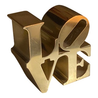 Authentic Vintage 1970s Robert Indiana "Love" Brass or Gold-Tone Paperweight For Sale
