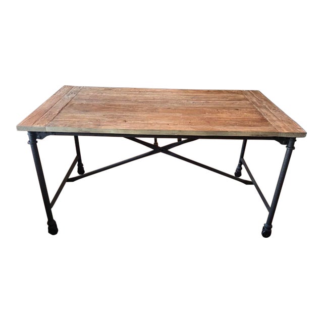 Tabletop is handcrafted of antiqued reclaimed elm on a wood frame Reclaimed Natural Elm finish is crafted from antique...
