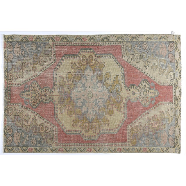 This beautiful vintage Turkish tribal rug features a bold central medallion surrounded by softly rendered tribal and...