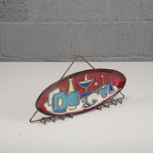 This exclusive mid-century modern-style wall-mounted key rack is an extraordinary example of the artistic design of the...