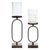 Elevate your home ambiance with this stunning set of Rust & Black Metal Candle Holders with Glass Hurricane. Featuring...