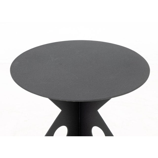 Postmodern Black Patinated Metal Side Table, with geometric tripod base and circular top. 24.25" H x 18" Diameter....
