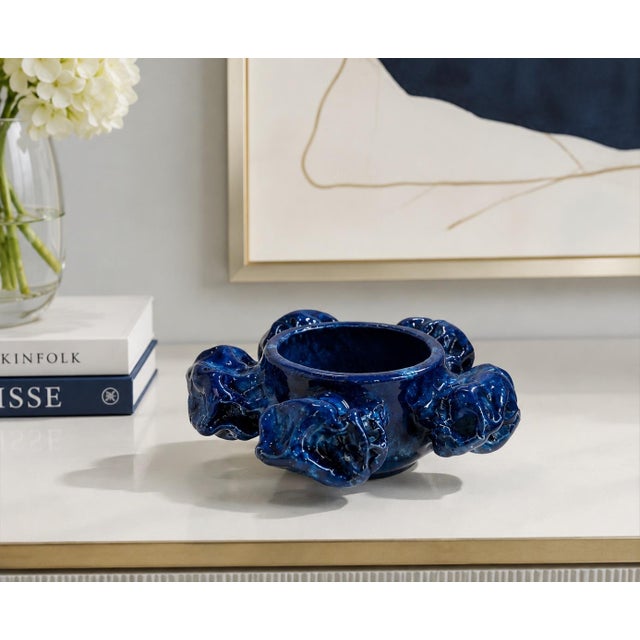 This rare and sculptural Kaamoskivi candle holder, officially titled “Kaamoskivi Art Kynttelikkö Kuusihaarainen,” is a...