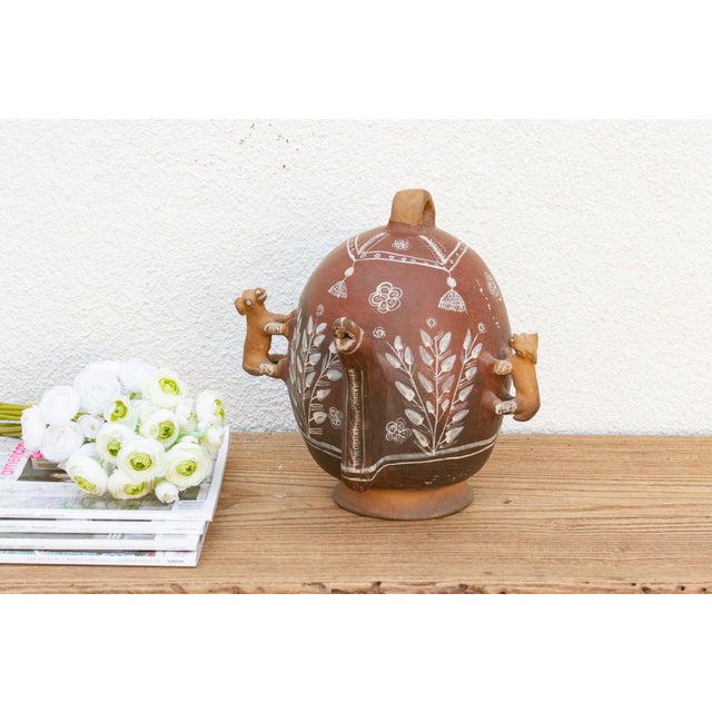 A captivating piece of latin America folk art, this antique Peruvian Quinua vase showcases a unique zoomorphic design. The...