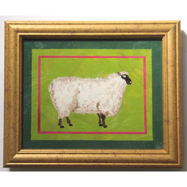White sheep, black face in shades of forest and lime greens with a hint of raspberry red in the border. Americana, Realism...