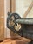 This is a late 19th century antique garden urn. It is made out of cast iron. It is in the French Neoclassical style. It...