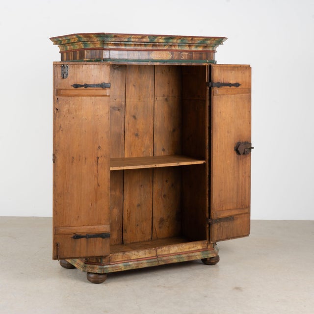 Hungarian two-door armoire dated 1803, crafted in pine and retaining its beautifully aged original hand-painted folk art...