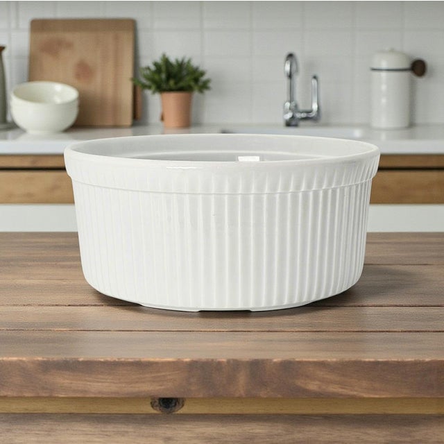 This French porcelain soufflé dish was produced by Apilco, a long-established maker of professional culinary porcelain...