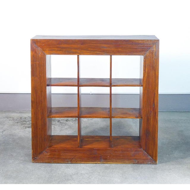 Open bookcase shelf, in ethnic style, entirely made of wood. Twentieth century period twentieth century materials solid...