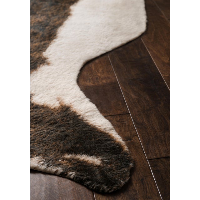 The Grand Canyon is a contemporary rug made in China from woven synthetics. The captivating look and colors are sure to...