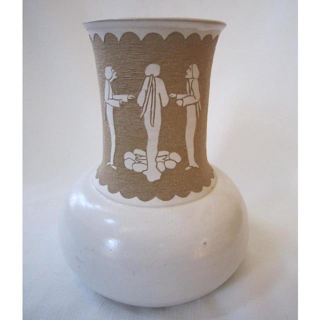 Gorgeous Michael Anderson relief pottery vase with Asian design. It measures 10"H x 8"D and is in excellent condition.