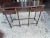 Vintage carved wood console table with three drawers, shaped top and turned legs. A traditional vintage accent for an...