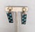 Circa late 1960s goldtone round domed top with rectangular drop with checked sections of navy blue, turquoise and green...