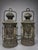 Set of four antique maritime lanterns, early 20th century. Each lantern is constructed with a cylindrical brass and copper...