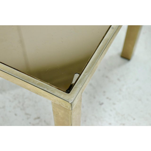 Set nesting tables by Belgo Chrom from the 1970s. The tables have a 23k gold plated frames and mirror glass. This piece...
