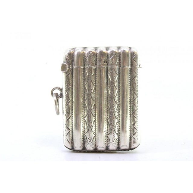 Silver Matchbox with Reliefs and Fluted Engravings, in Very Good conditions. Designed 1890 to 1919 This piece has an...
