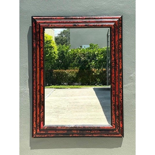 This exceptional 19th-century mirror is a refined expression of period craftsmanship, distinguished by its richly layered...