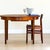 A beautiful Mid-Century round extending dining table designed by John Herbert and handcrafted by A. Younger in Britain...