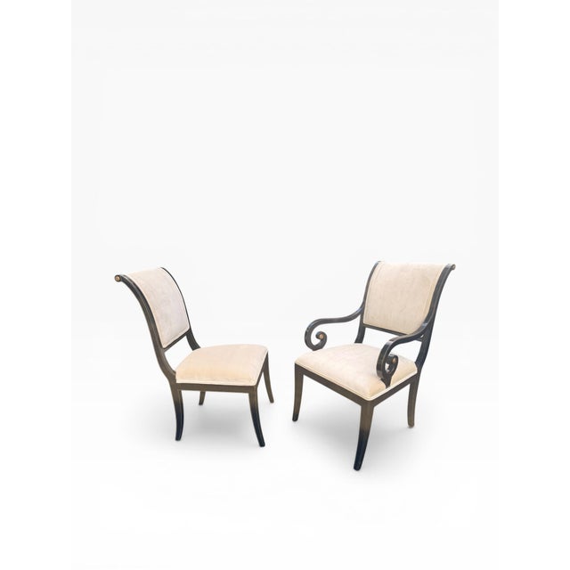 A refined set of ten dining chairs by Kindel Furniture Company, showcasing elegant neoclassical styling with sculptural...