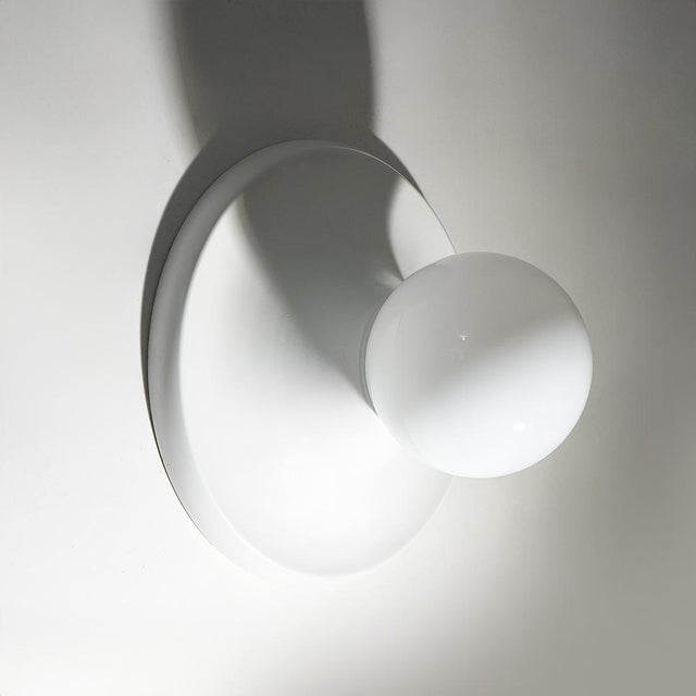 A pair of “light ball” ceiling lamps designed by achille and pier giacomo castiglioni for flos in the 1960s, an emblematic...