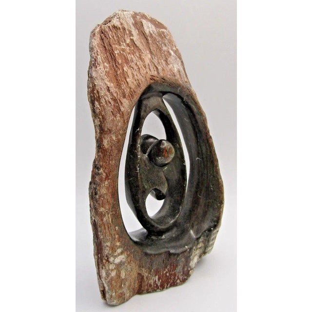 Emerson Butawu African Shona Carved Serpentine Stone Sculpture Measures 4 3/4" wide, 2 1/2" deep and 7 1/2" tall. This...