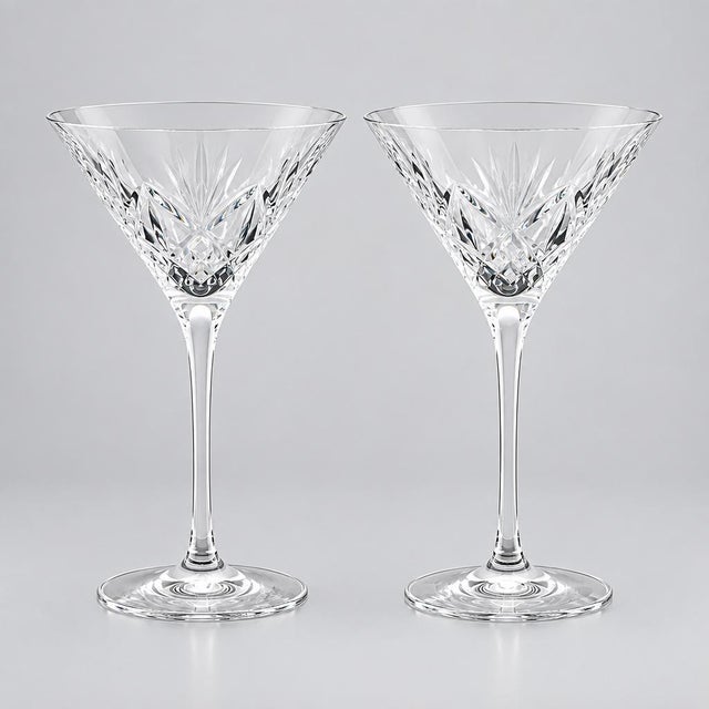 Waterford crystal martini pair in retired Huntley pattern. Cut criss-cross and fan design bowl with smooth, elegant...