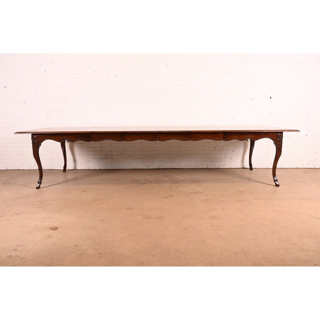 An exceptional Italian Provincial or Louis XV style extension dining table By Baker Furniture USA, Circa 1980s Gorgeous...