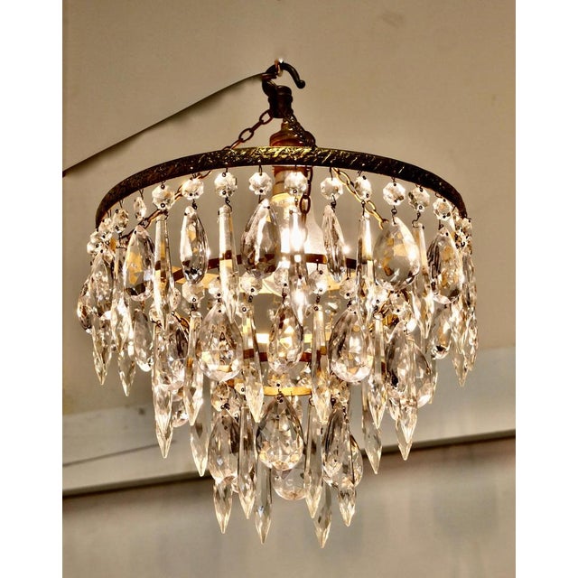 A charming waterfall 3-tier pendant chandelier A charming waterfall tiered pendant chandelier, this delicate light has...