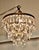 A charming waterfall 3-tier pendant chandelier A charming waterfall tiered pendant chandelier, this delicate light has...