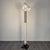 We are looking at a superb specimen of the Shogun floor lamp, a piece that has marked the history of postmodern design....